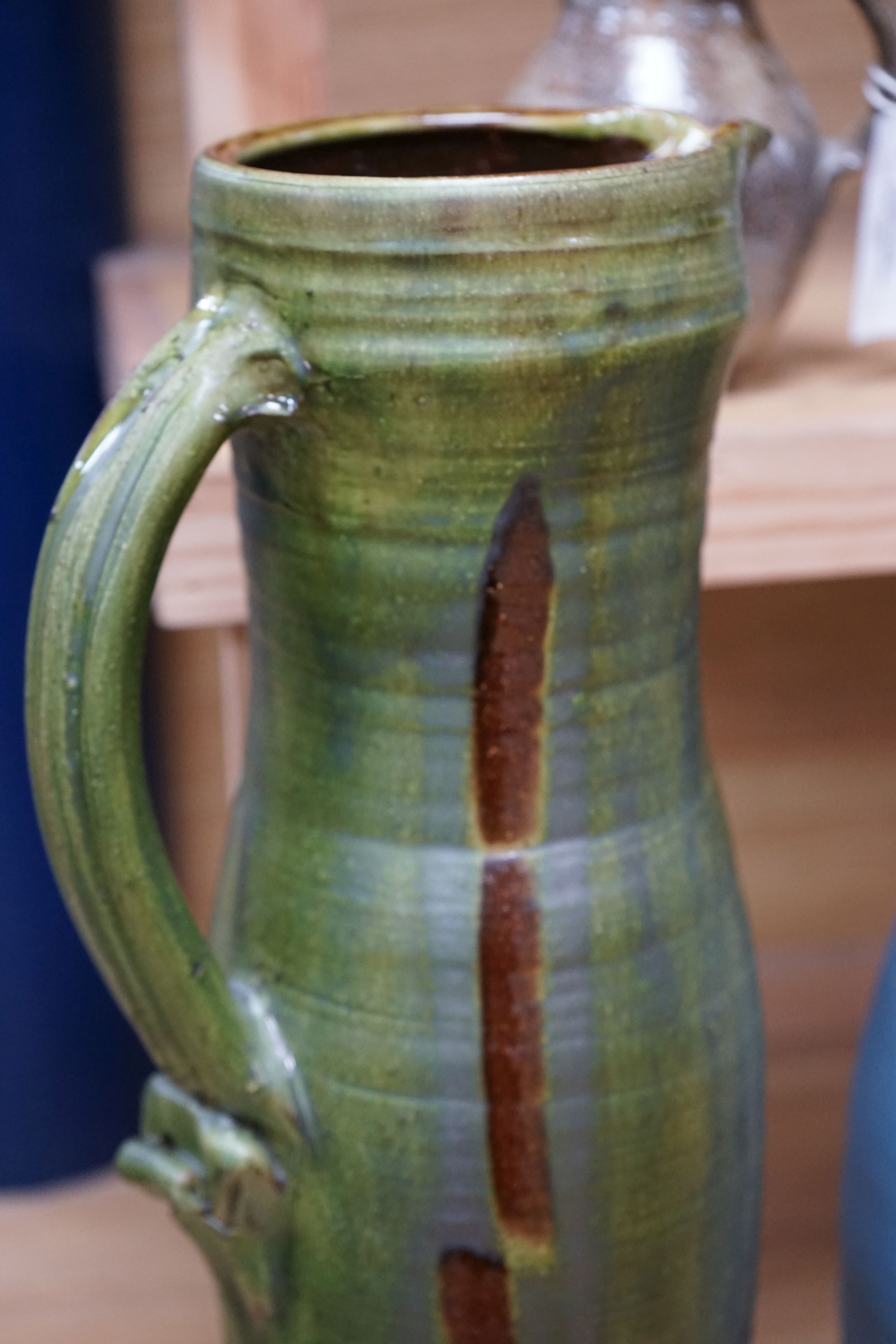 Clive Bowen (b.1943), a tall green glazed and brown slip decorated ewer, 59cm